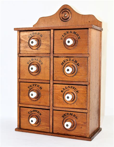 wooden spice cabinet with drawers